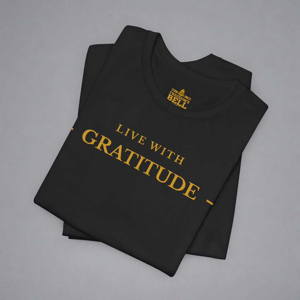 Black t-shirt with 'Live with Courage' text on a gray background