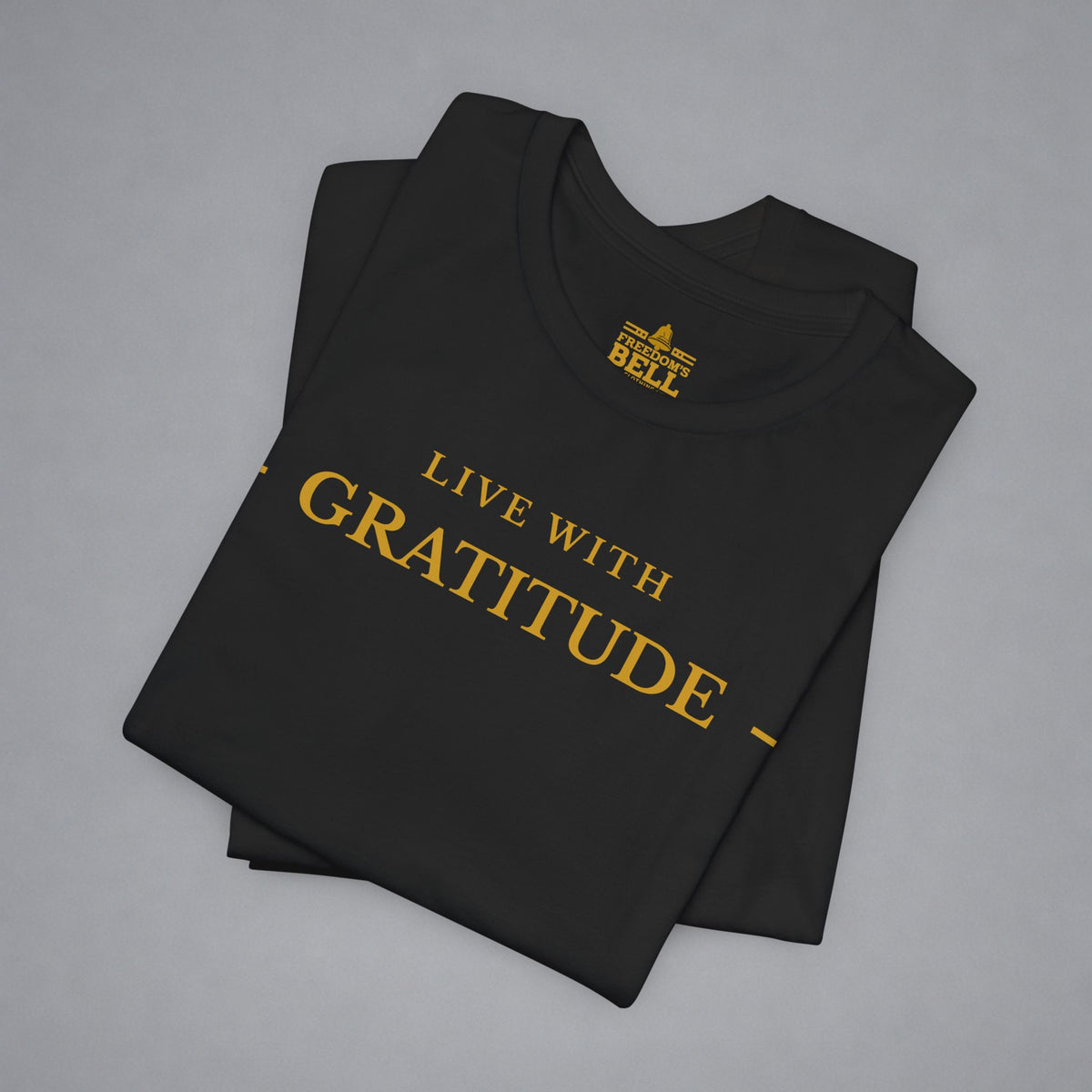 Black t-shirt with 'Live with Courage' text on a gray background