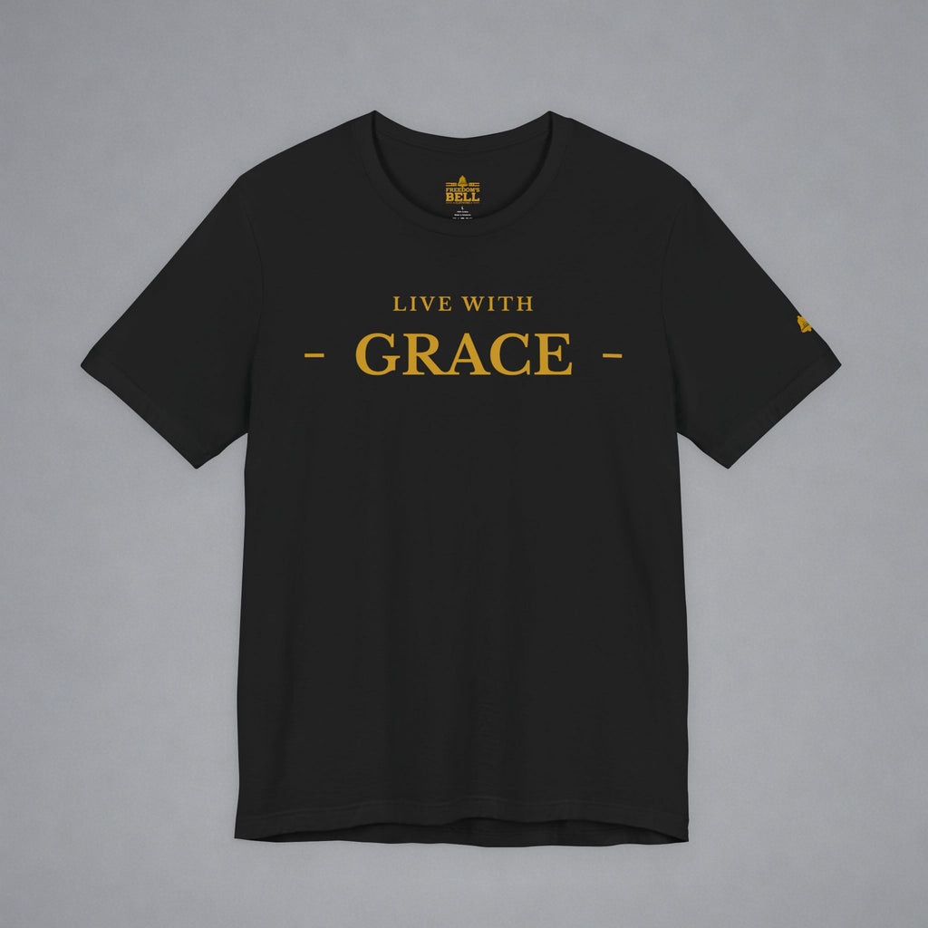 A black short-sleeve crewneck t-shirt with 'LIVE WITH GRACE' printed in gold on the chest, displayed flat against a neutral gray background.