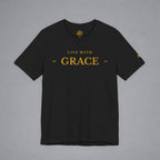 A black short-sleeve crewneck t-shirt with 'LIVE WITH GRACE' printed in gold on the chest, displayed flat against a neutral gray background.