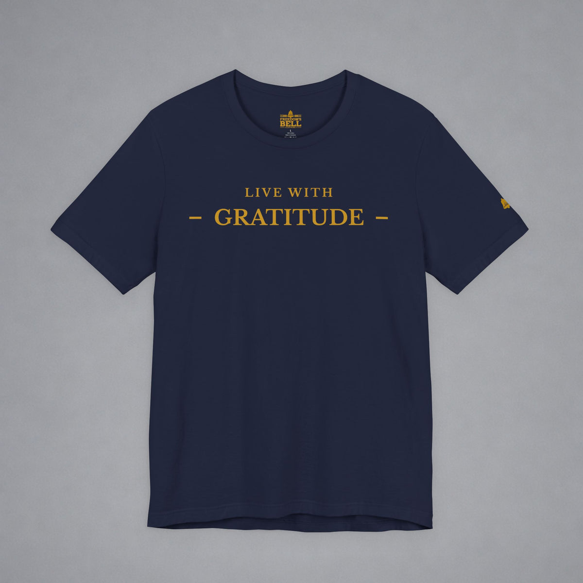 A navy blue short-sleeve t-shirt with 'LIVE WITH GRATITUDE' printed in gold across the chest, displayed flat against a neutral gray background.
