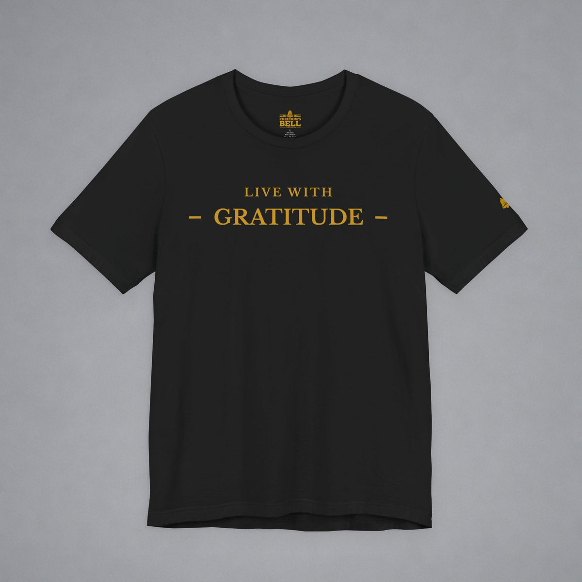 A black short-sleeve crewneck t-shirt with 'LIVE WITH GRATITUDE' printed in gold on the chest, displayed flat against a neutral gray background.