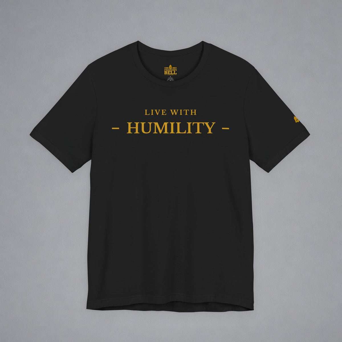 A black short-sleeve crewneck t-shirt with 'LIVE WITH - HUMILITY -' printed in gold across the chest, displayed flat against a neutral gray background.