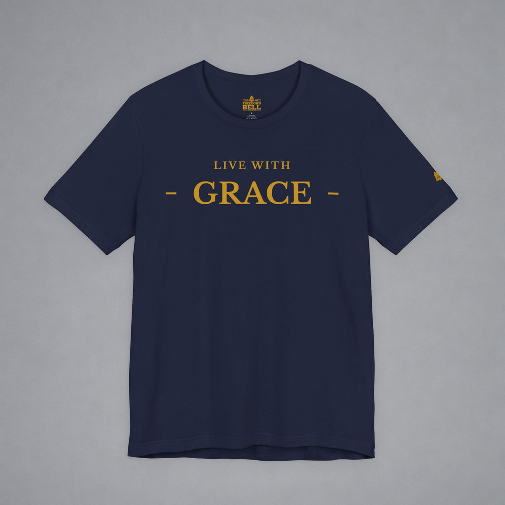 A navy blue crewneck t-shirt with 'LIVE WITH GRACE' printed in gold on the chest, displayed flat against a neutral gray background.