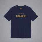A navy blue crewneck t-shirt with 'LIVE WITH GRACE' printed in gold on the chest, displayed flat against a neutral gray background.