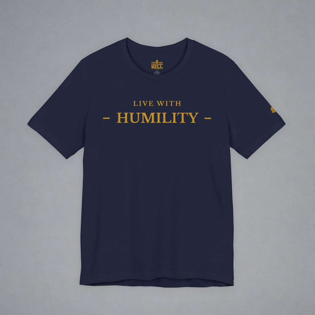 A navy blue crewneck t-shirt with 'LIVE WITH HUMILITY' printed in gold across the chest, displayed flat against a neutral gray background.