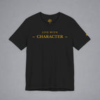 A black short-sleeve crewneck t-shirt with 'LIVE WITH CHARACTER' printed in gold on the chest, displayed flat against a neutral gray background.