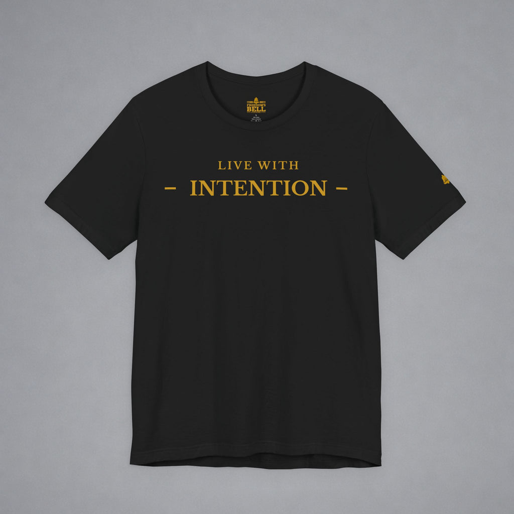 A black short-sleeve crewneck t-shirt with 'LIVE WITH INTENTION' printed in gold across the chest, displayed flat against a neutral gray background.