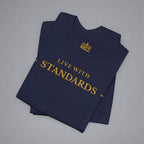 A folded navy blue t-shirt with gold text reading 'LIVE WITH INTENTION.