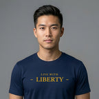 Man wearing a navy blue t-shirt with 'LIVE WITH LIBERTY' text on a gray background